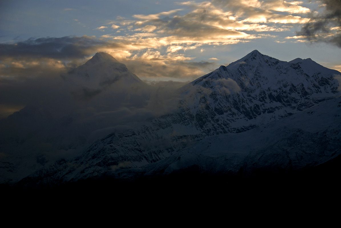 04 Dhaukagiri And Tukuche Peak Before Sunset From Kharka On Way To Mesokanto La Clouds slightly parted at sunset revealing Dhaulagiri and Tukuche Peak from our camp on the kharka (3460m) above Jomsom on the way to Tilicho Lake.